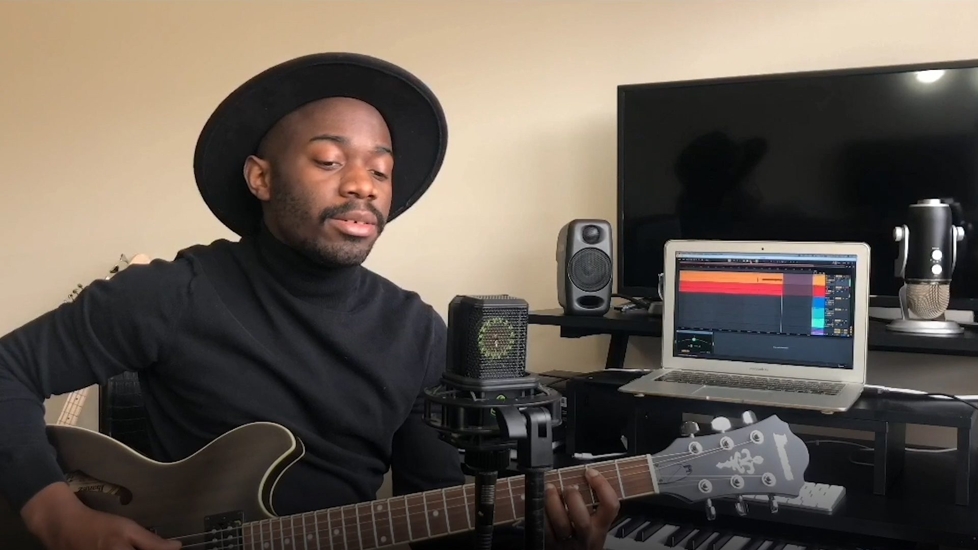 Ephraim plays the guitar and records a song